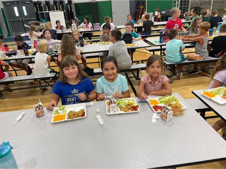 first grade students at lunch